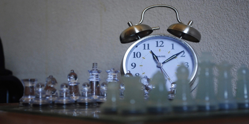 A clock demonstrating how manual work is slowing down the clock, instead switch to AI in project management